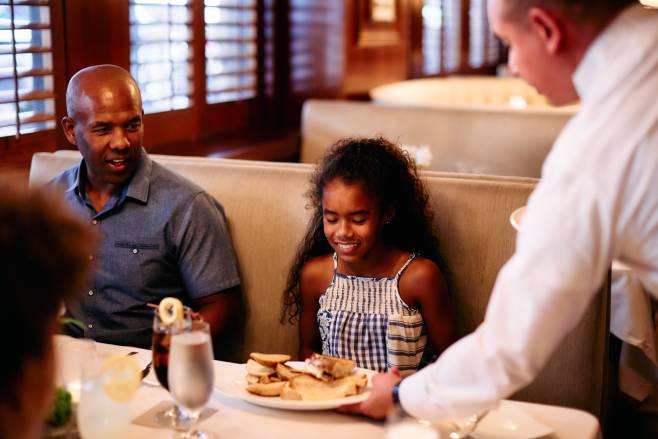 Daughter at restaurant with her dad